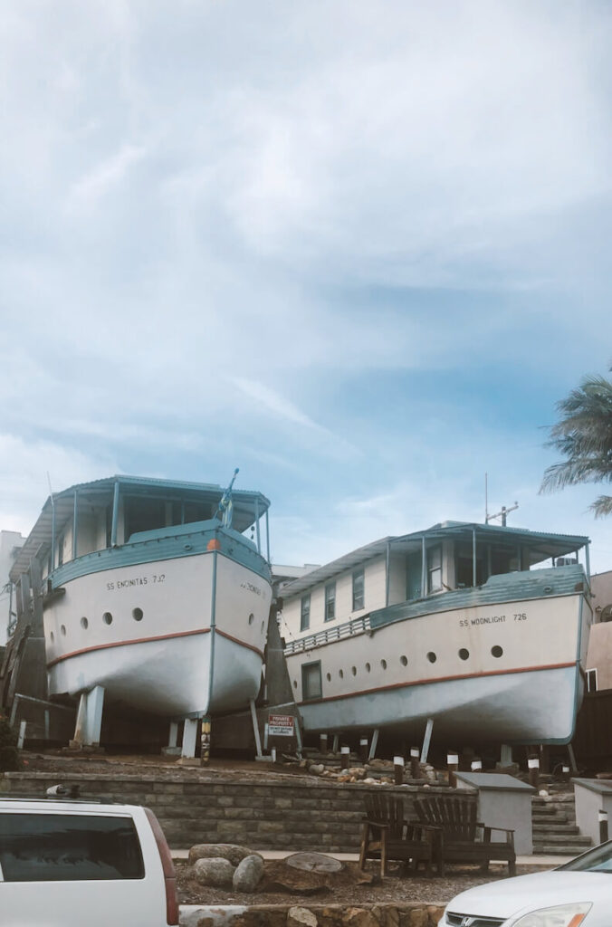 Two houses shaped like boats in Encinitas. They are painted blue on top, with a white base.