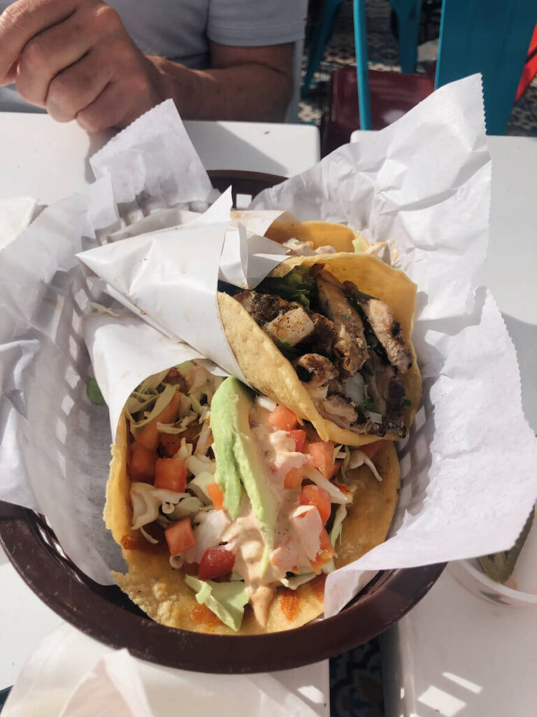 Two tacos in a basket at The Taco Stand