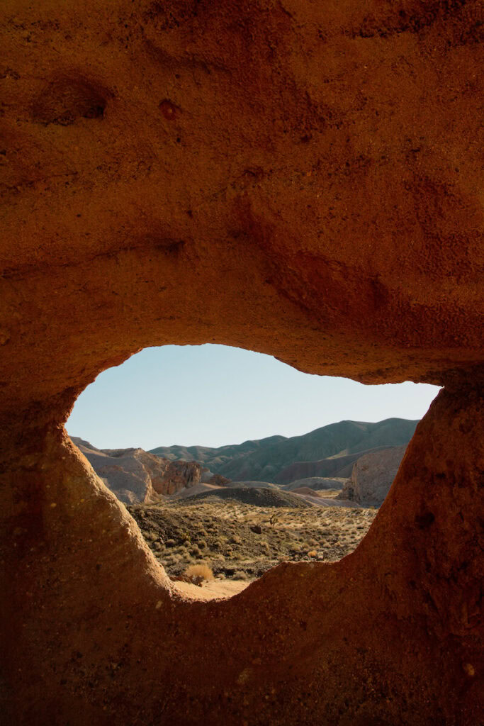 View of desert landscape through Window Rock at Hagen Canyon