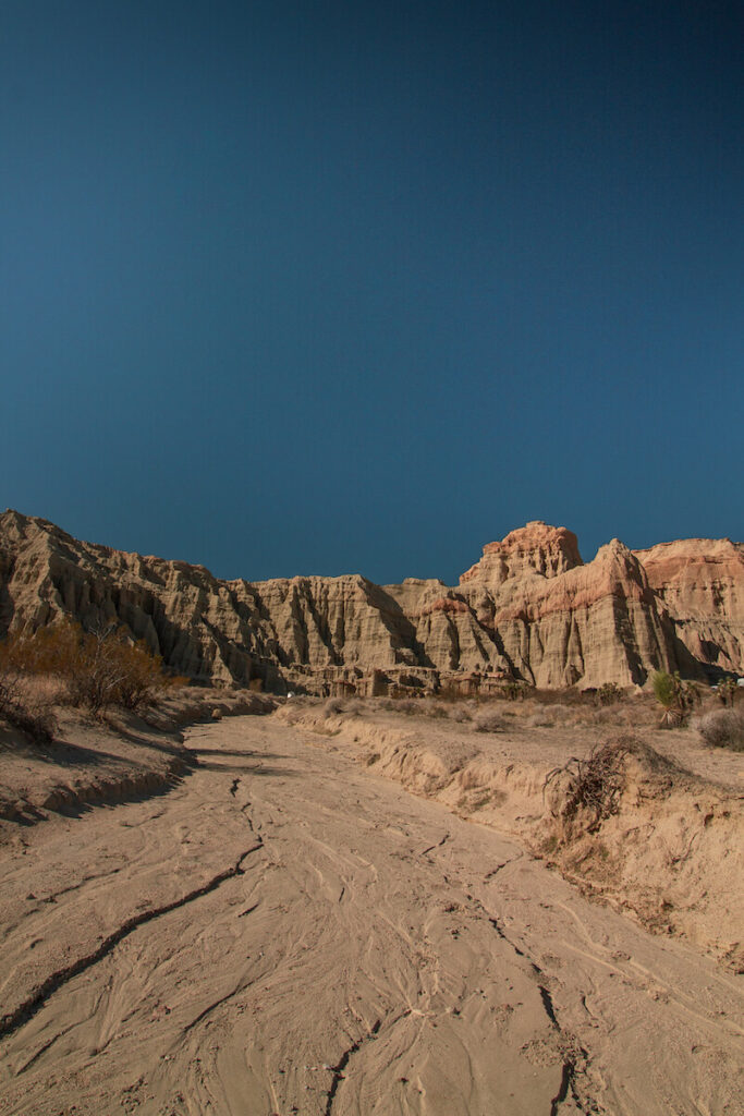 Sandy trail leading to cliffs at Red Rock Canyon