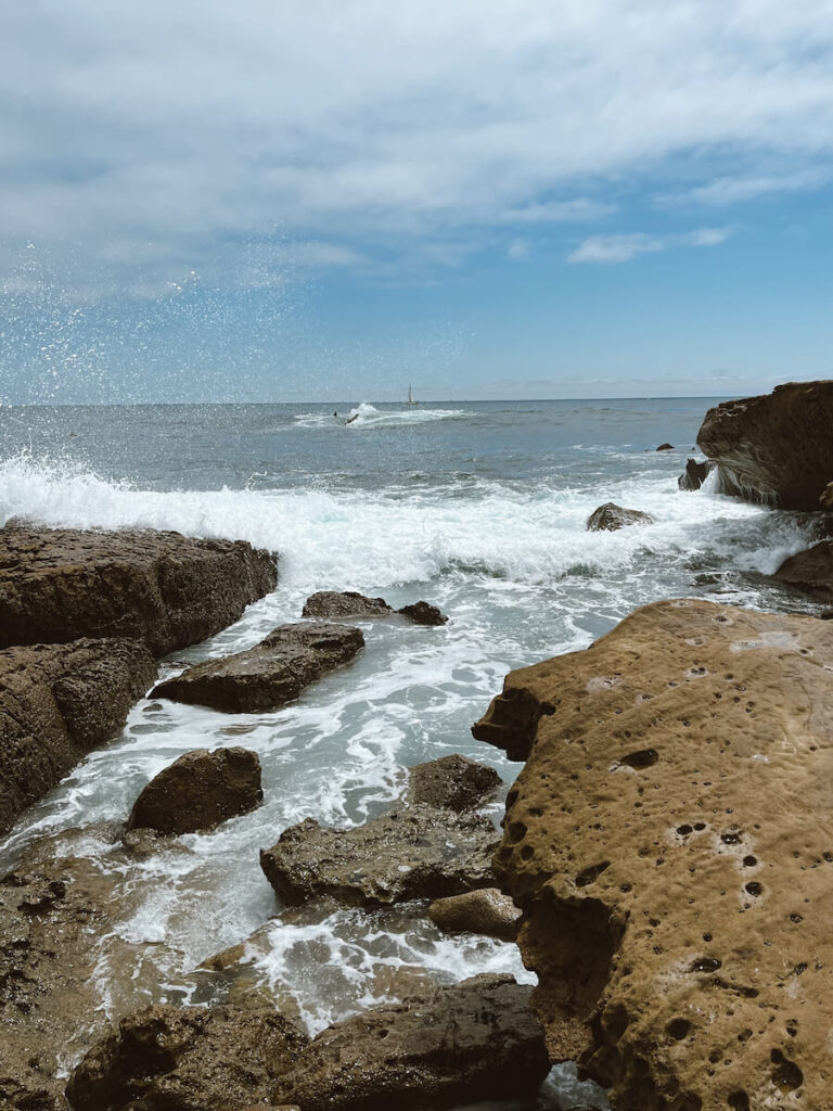 Small waves crashing into tide pools in Laguna Beach