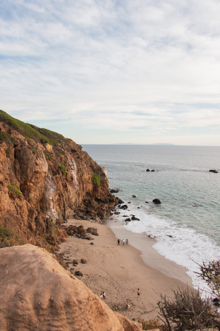 View of a rocky beach and coastal cliffs from above on the Point Dume Trail