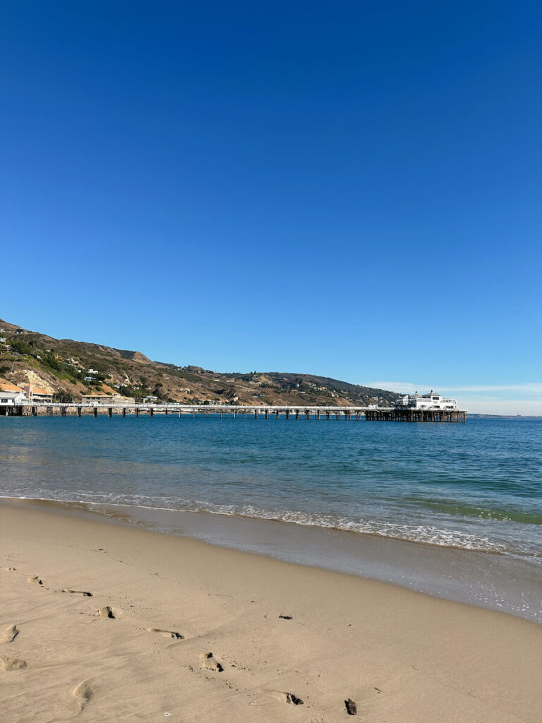 View of the Malibu Pier from the sand at Surfrider Beach