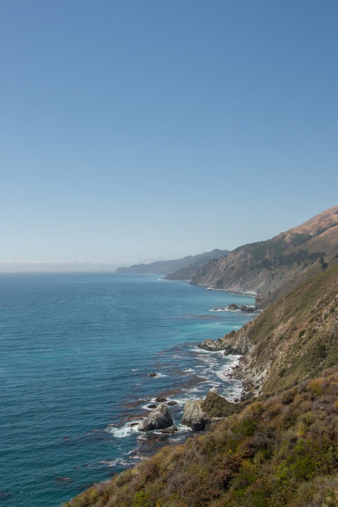 View of the rocky Big Sur coast from Seal Beach Overlook on a sunny day