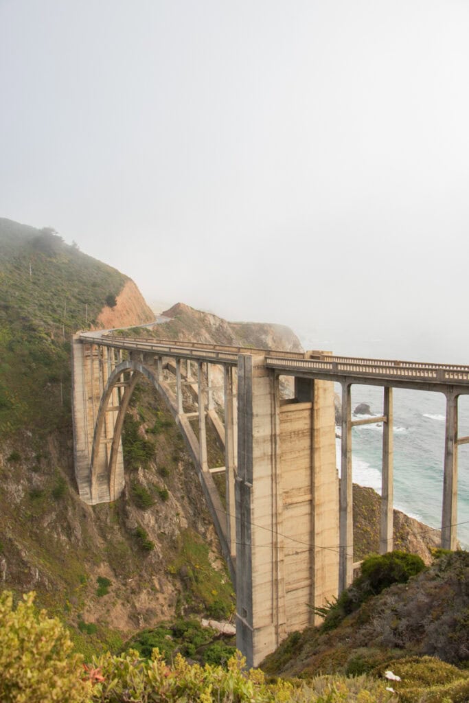 The back side of Bixby Bridge, with the ocean visible in front of it