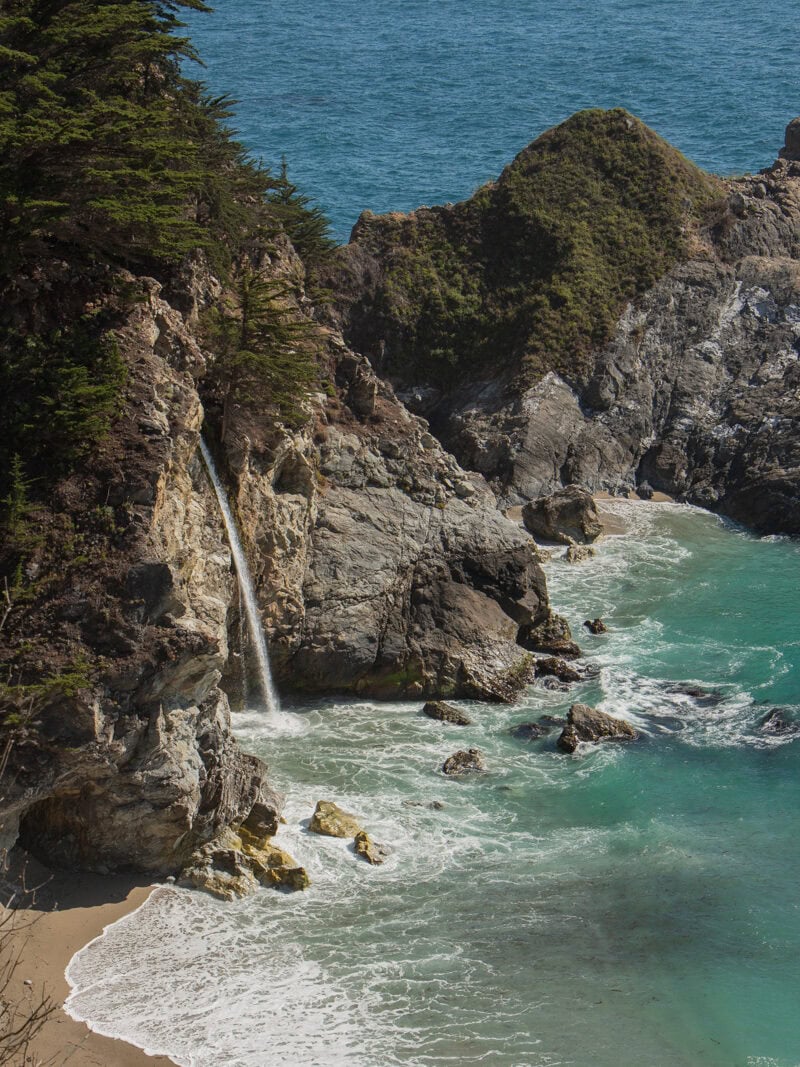 A closeup look at McWay falls crashing onto the beach