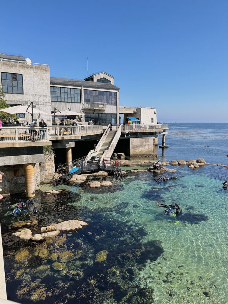 A building of Monterey Bay Aquarium, which juts out into the shallow ocean water