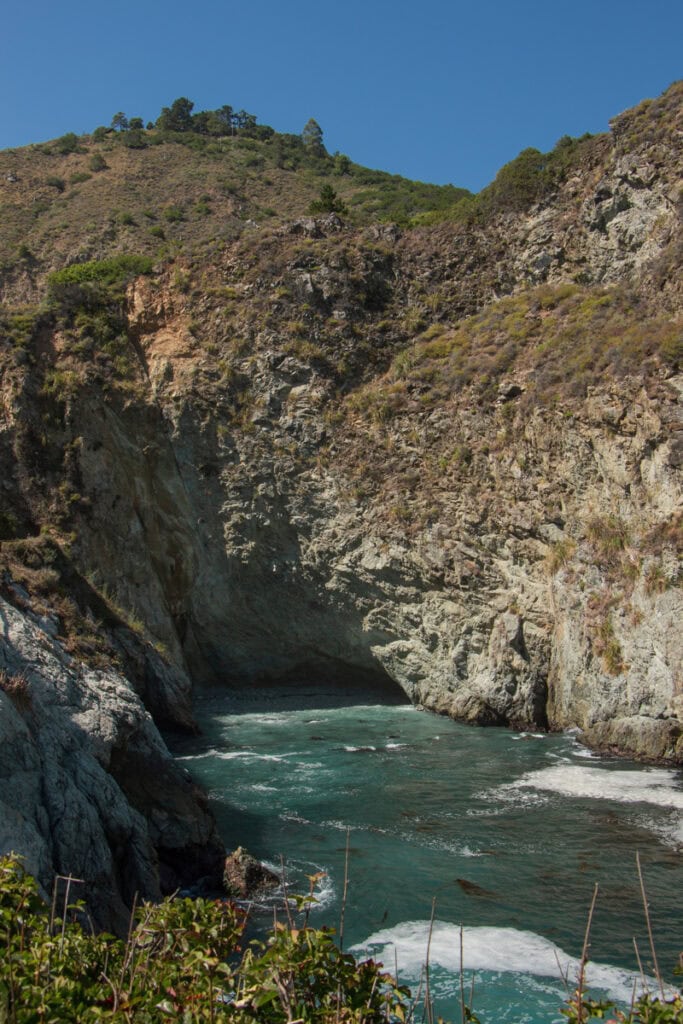 Looking into Partington Cove, which is surrounded by towering coastal cliffs