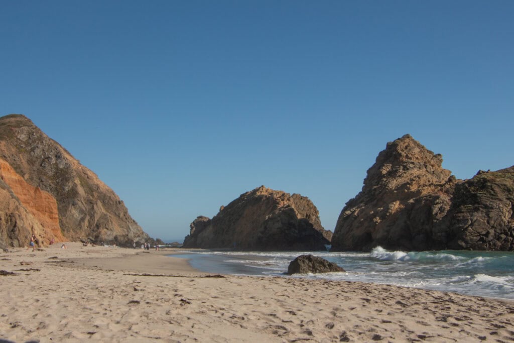 A collection of massive boulders in the water at Pfeiffer Beach