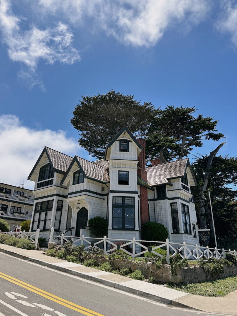 The front of a white Victorian building in Pacific Grove