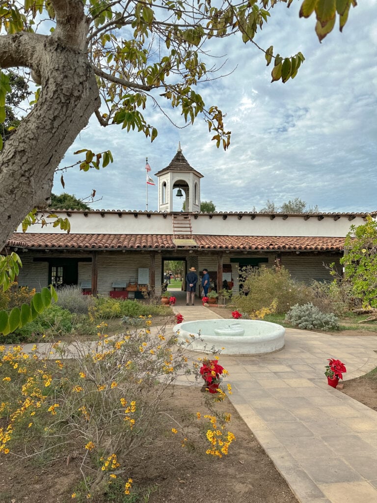 A historic plaza in Old Town, with a short fountain in the center