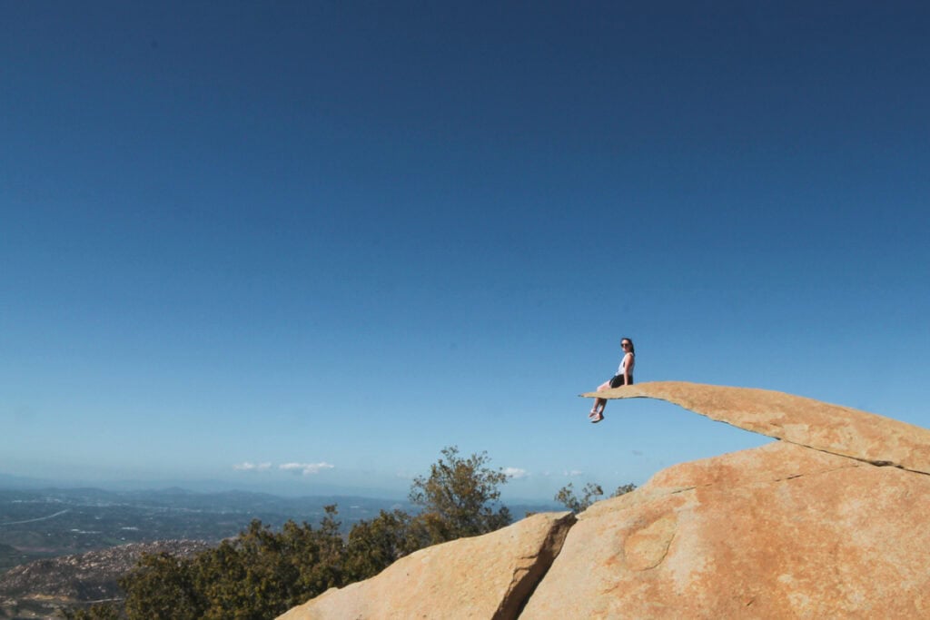 Woman sitting on Potato Chip Rock