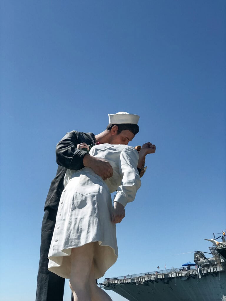 The Unconditional Surrender statue in front of the USS Midway