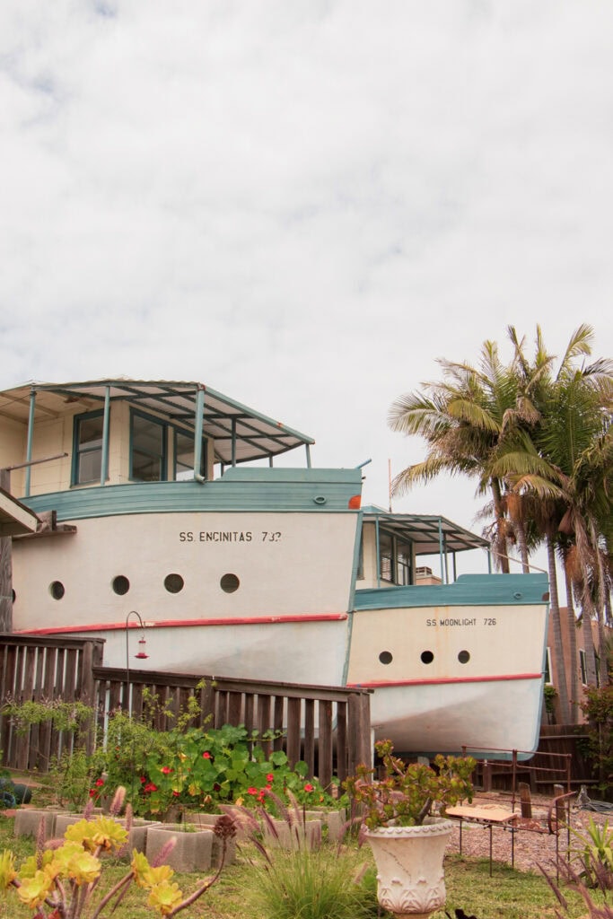Two houses shaped like boats in Encinitas. They are white with light blue and orange trim.