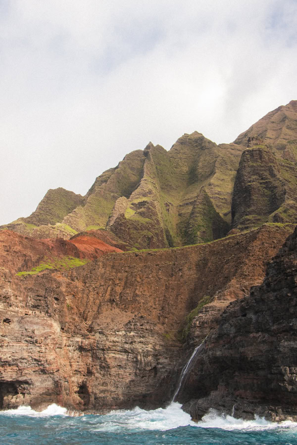 A view of towering cliffs on the Na Pali Coast from a boat 