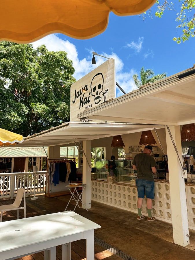A sign for Java Kai over the order counter and outdoor eating area