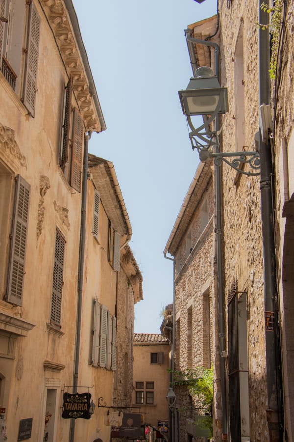 A lampost and the view down a narrow passageway