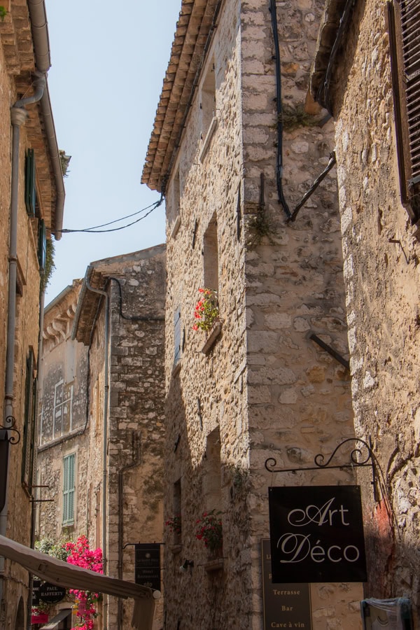 A view of the stone buildings surrounding a narrow passageway