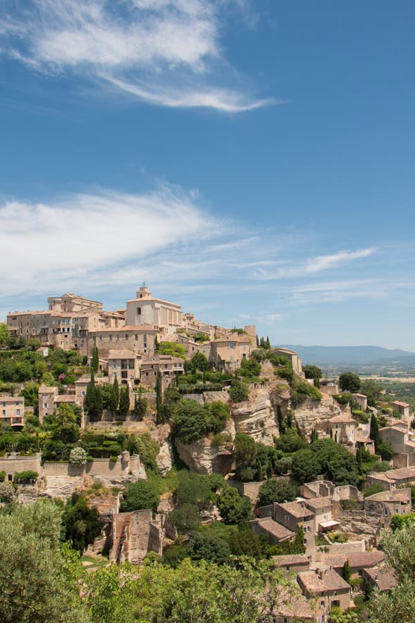 A view of the town of Gordes on the hilltop from the Gordes viewpoint just outside of town