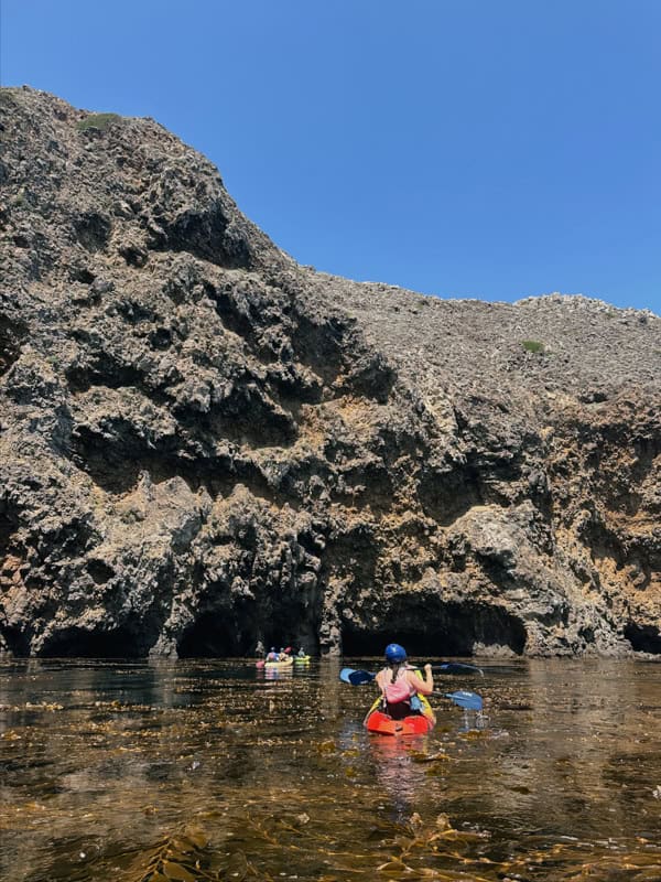 Kayakers kayaking off the coast of Santa Cruz Island